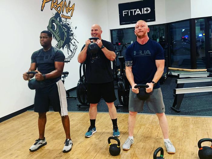 Three men working out together