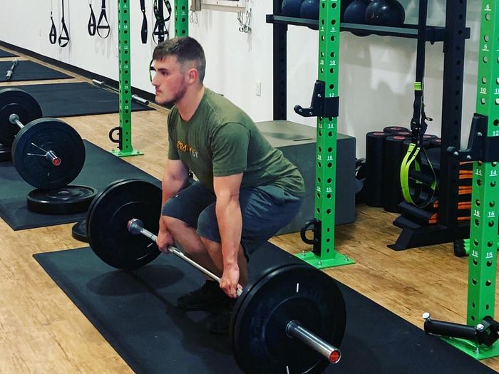 Man doing squats with a barbell