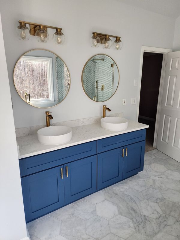 bath remodel with blue cabinets