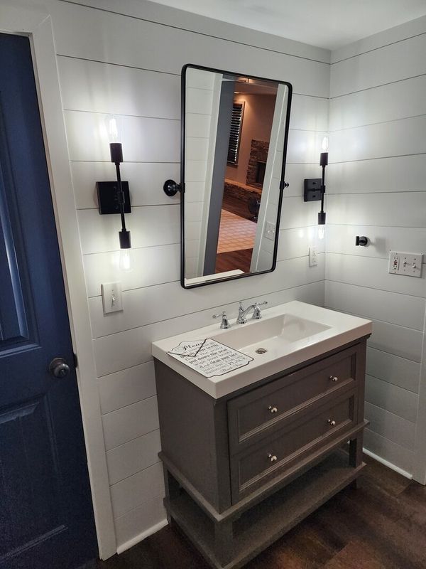 bath remodel tilted mirror.