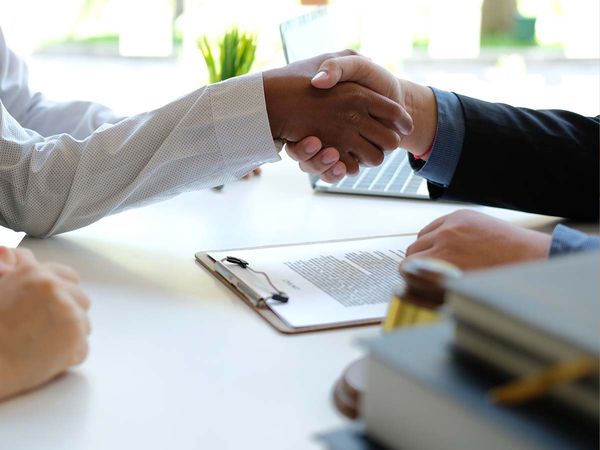 A closeup of two people shaking hands