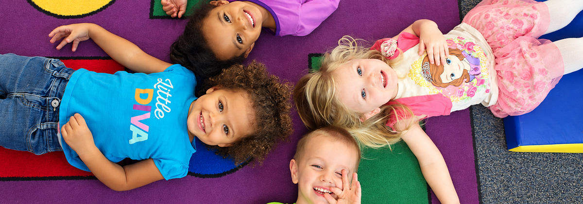 children on colorful rug