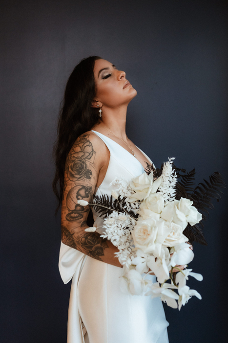 A gorgeous bride and her stunning all white bridal bouquet.