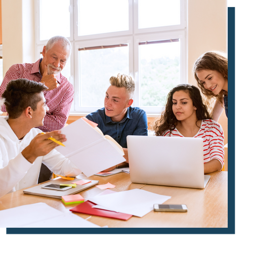 Students and teacher going over studies