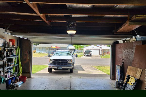 Thomas Garage Doors parked outside garage