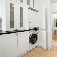 laundry room with white cabinets