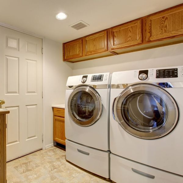 white washer and dryer in home laundry room