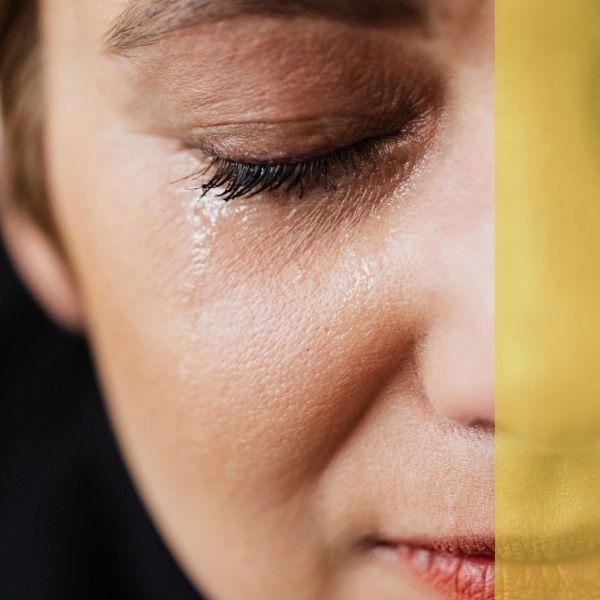 A close up image of a woman crying