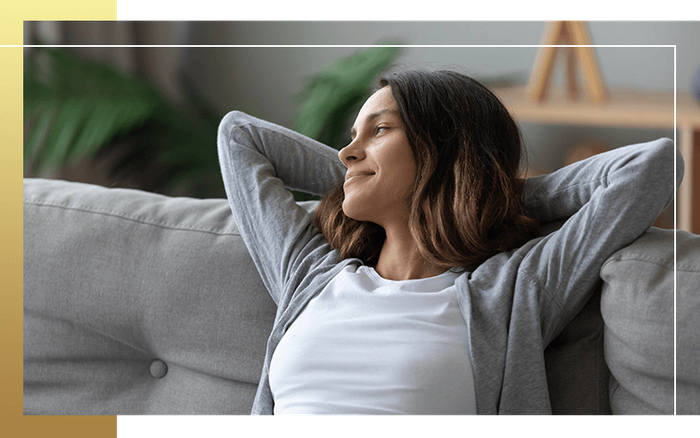 image of a woman relaxing on a couch