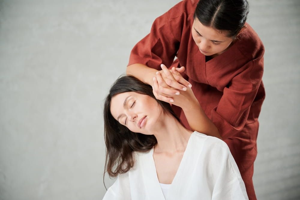 A woman with eased shoulder tension following an authentic Thai massage