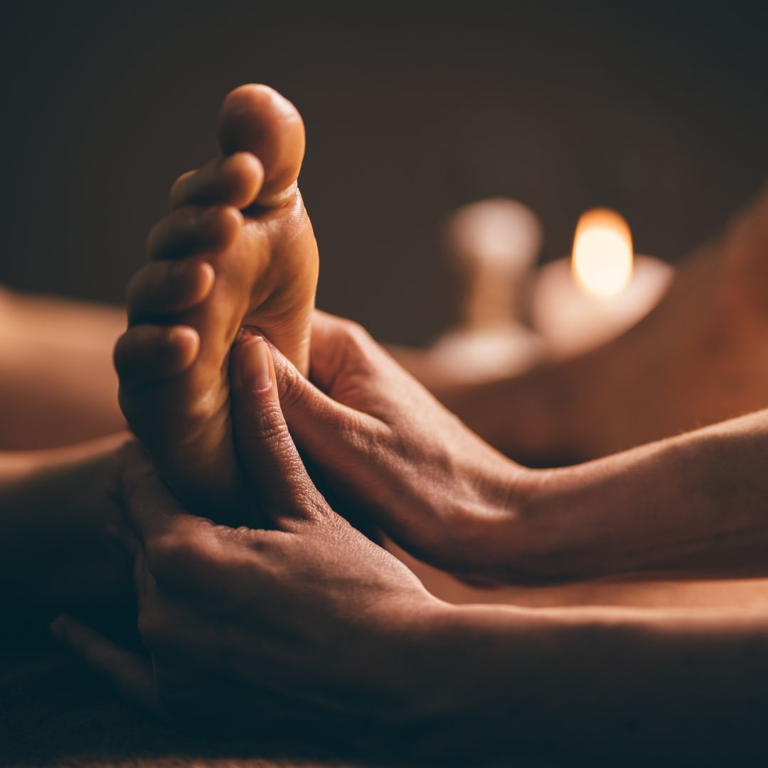 closeup of a man or woman receiving a thai foot massage 