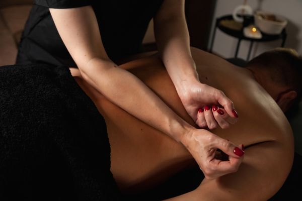 A therapist giving a back massage