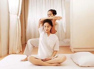 a woman receiving a thai massage