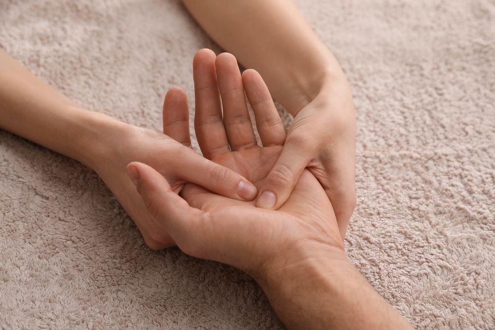 A man experiences a palm massage