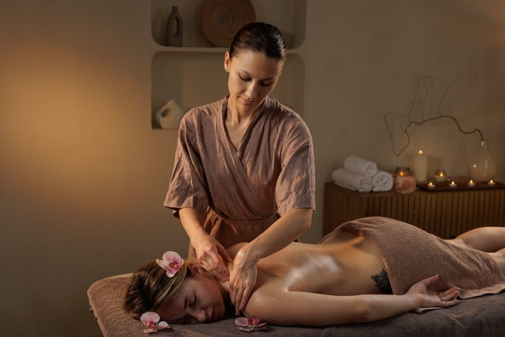 A therapist with therapeutic massage certification providing a relaxing full-body massage