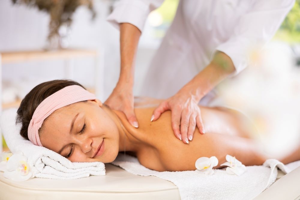 a woman enjoys a soothing Swedish massage