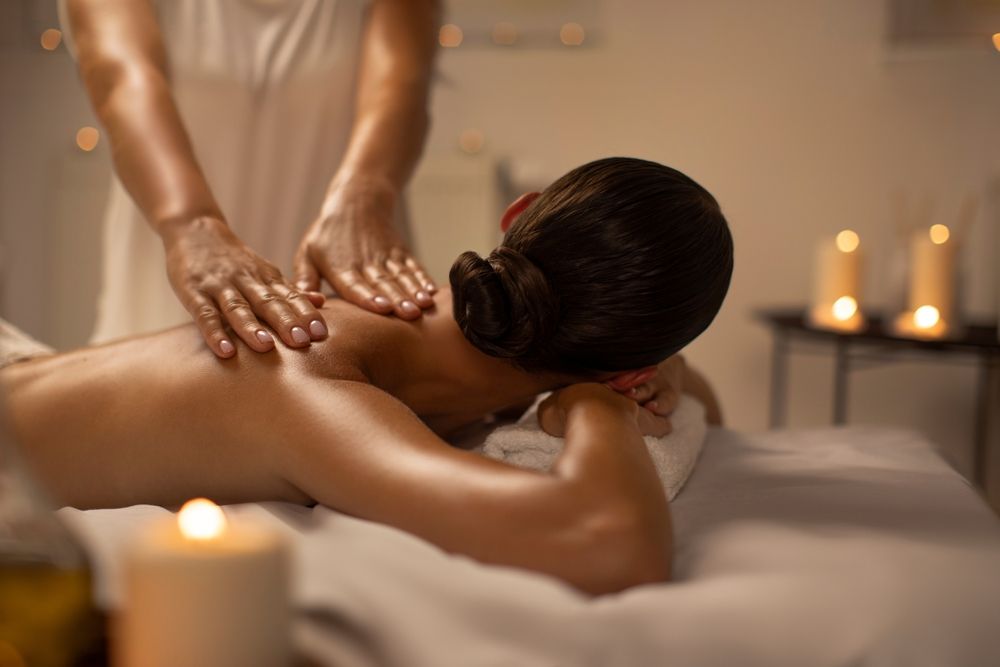 Woman enjoying a calming back massage, one of the best relaxing activities for mental health
