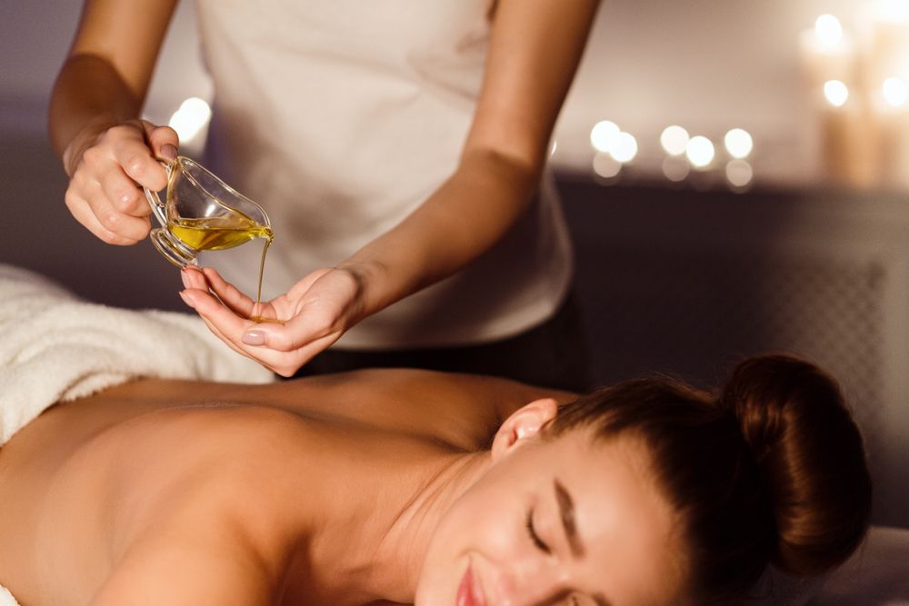 A woman getting an oil massage