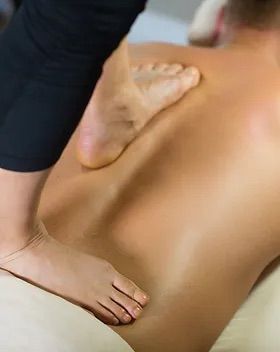 Closeup of a man receiving an ashiatsu massage