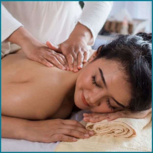 postpartum woman getting a massage