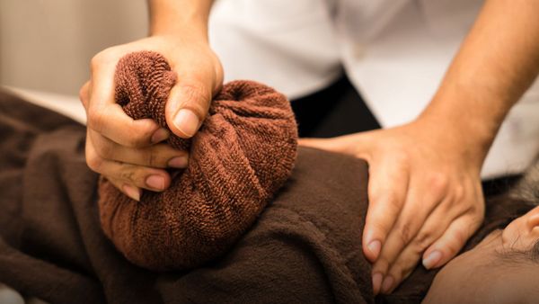 person getting a thai massage