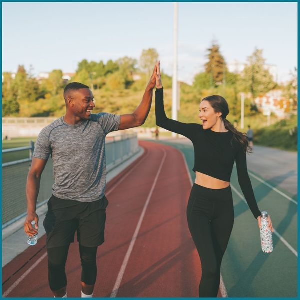 athletes high fiving