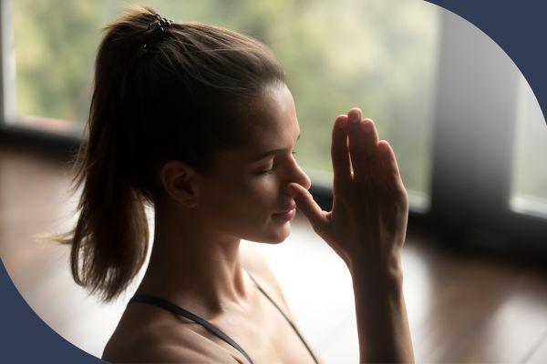 woman doing breathing exercise