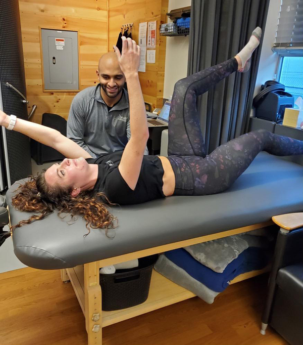 Woman lying on her back stretching