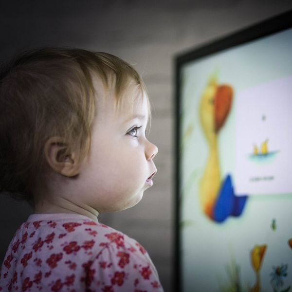 toddler sitting close to tv