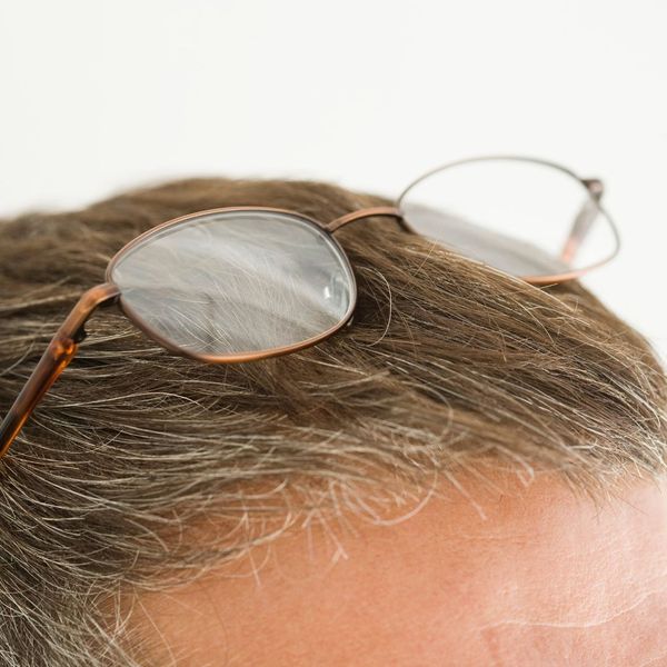 man wearing his glasses on his head