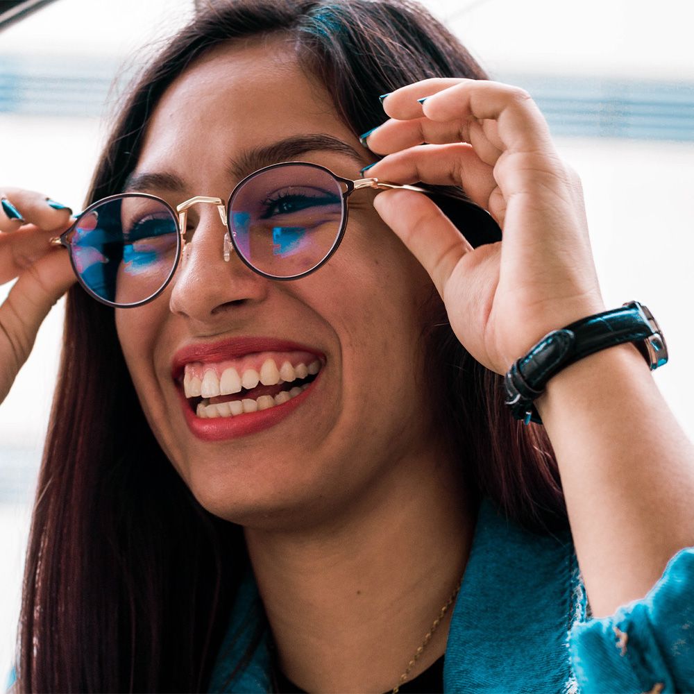 Woman with glasses smiling