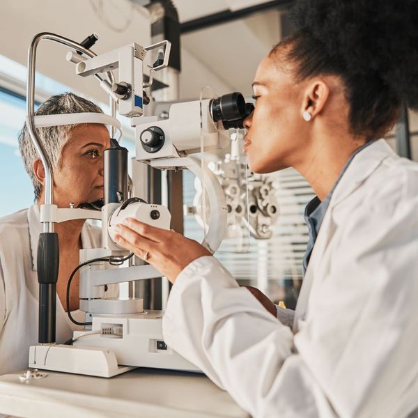 doctor giving woman eye exam