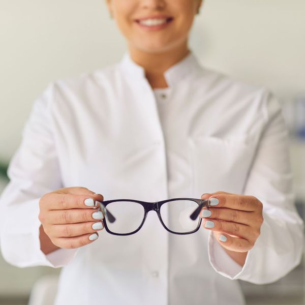 eye doctor holding glasses