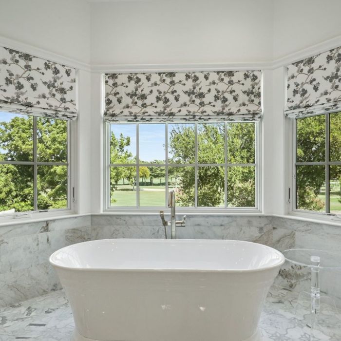 Freestanding tub with view in luxury bathroom