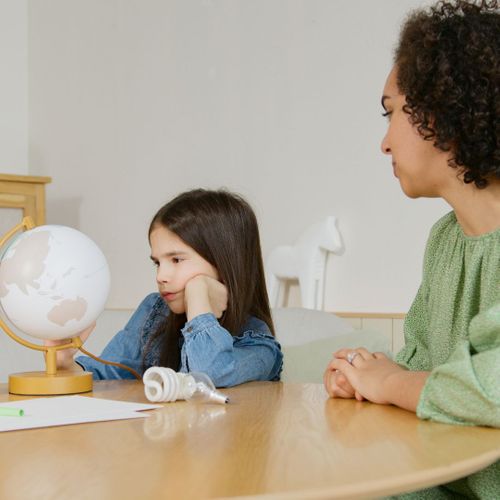 Woman looking at a young girl