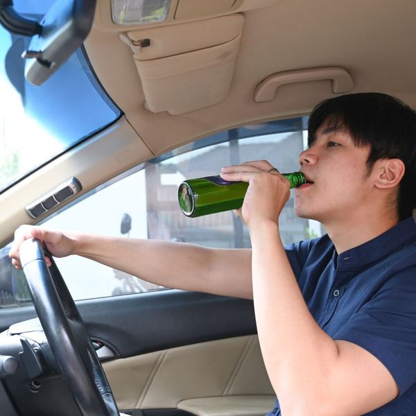a person drinking and driving