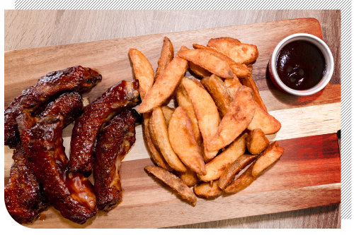 Image of ribs and potato wedges