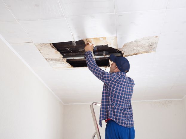 Man working in the ceiling 