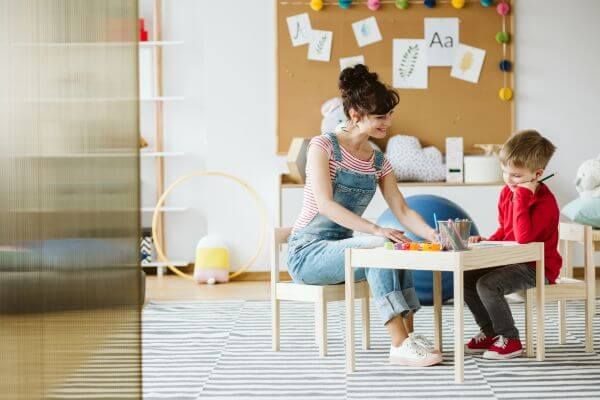 child with speech therapist