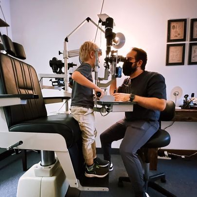 A little boy getting his eyes checked