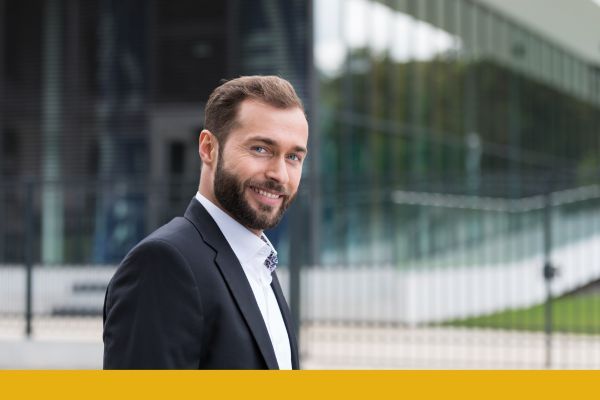 Business man outside a building