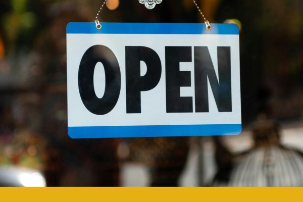 Open sign of business on glass window