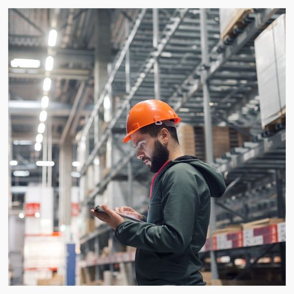 supply chain worker utilizing technology