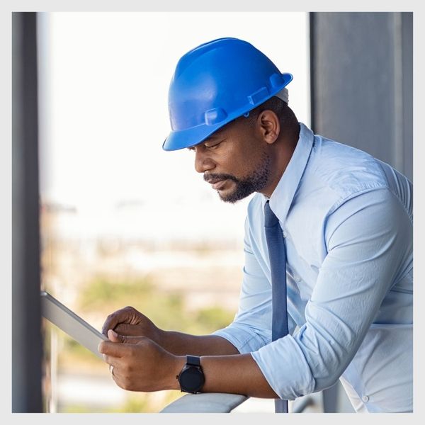 supply worker on tablet