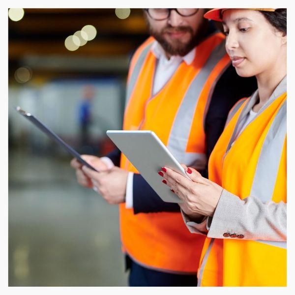 supply chain workers on tablets