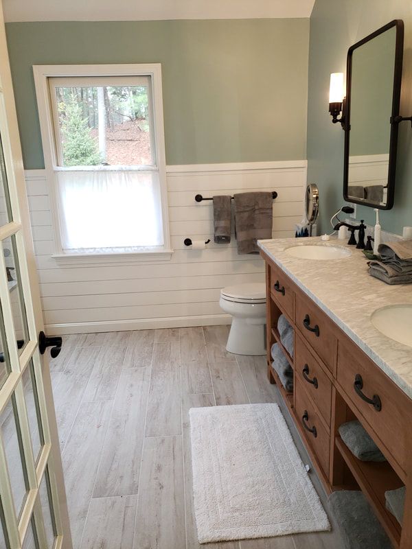 bathroom-remodel-tub-under-skylight-glassdoor-double-vanity-naturalstain-with-drawers-after.jpg