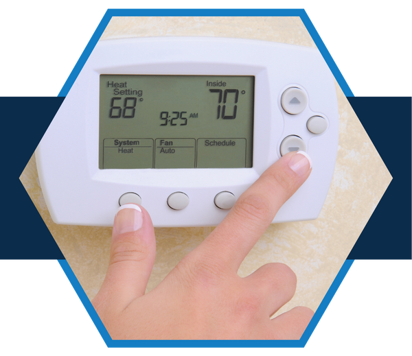 person adjusting a thermostat person adjusting a thermostat