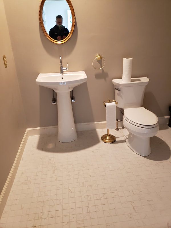 ivory-pedestal-sink-and-toilet-installation-beige-bathroom-after-install.jpg