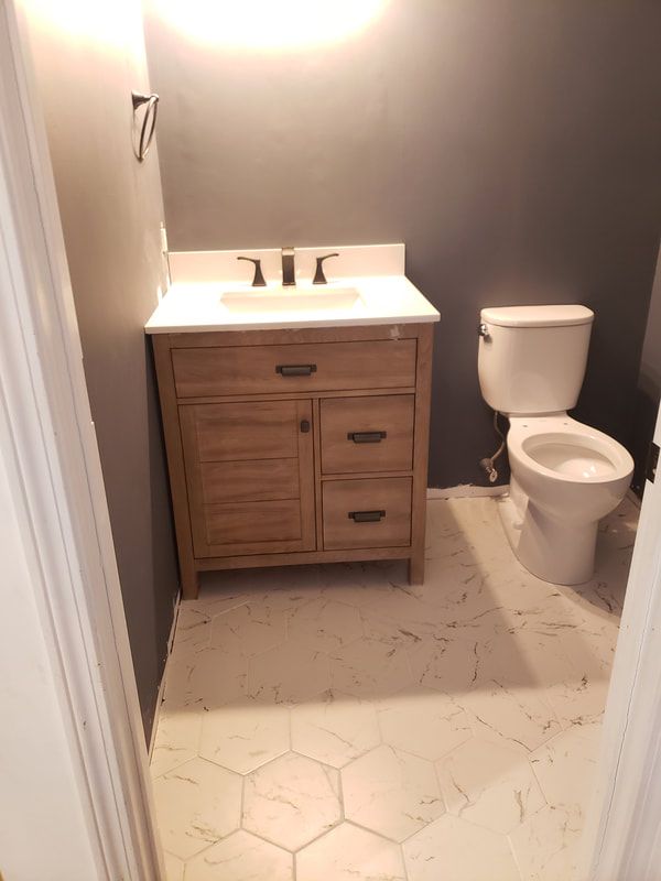 bathroom-remodel-vanity-faucet-toilet-installation-after_1.jpg