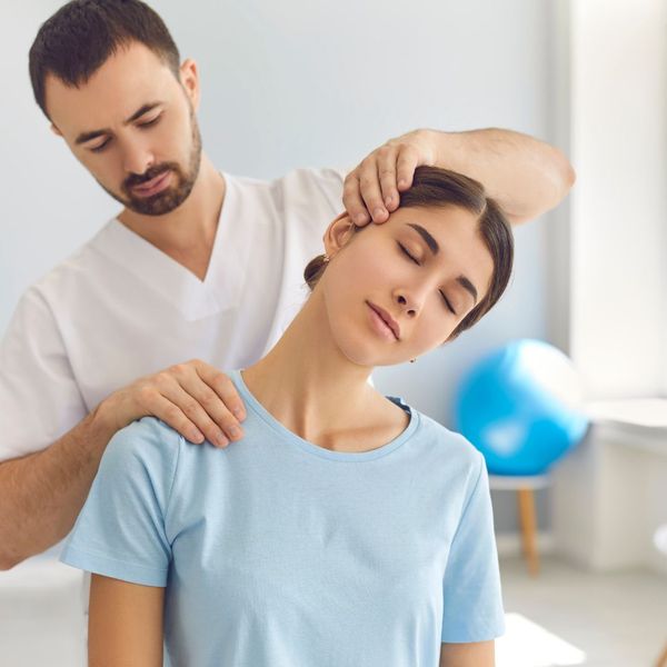 a woman getting a chiropractic adjustment The Role of Chiropractic Care (2).jpg